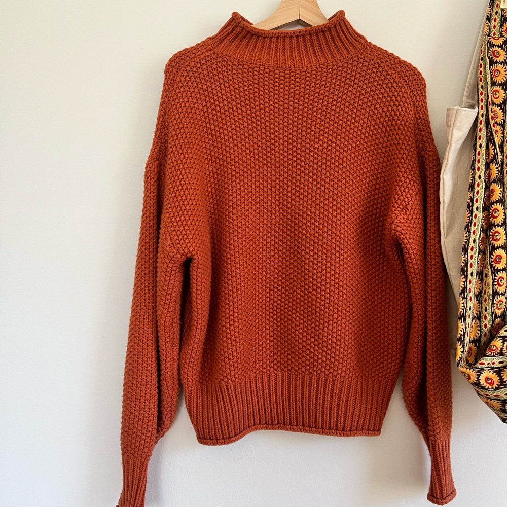 Orange turtleneck sweater
